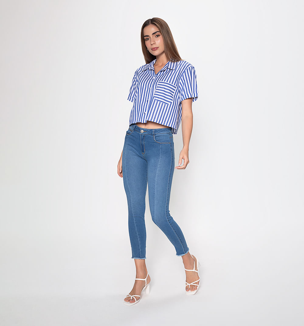 Jean skinny con cortes y ruedo rustico