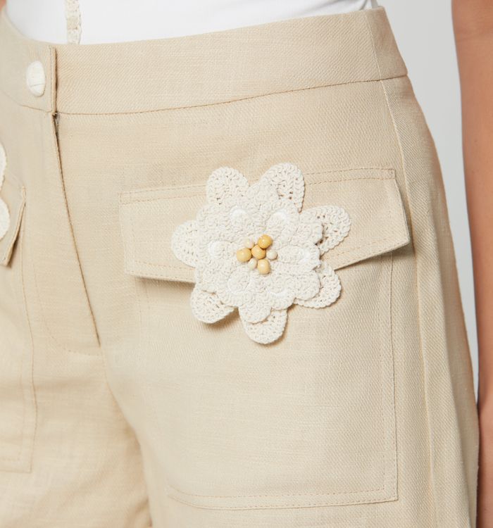 Short tiro alto bolsillos con flores